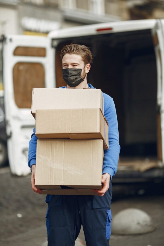 man-by-truck-guy-delivery-uniform-man-medical-mask-coronavirus-concept_1157-46179